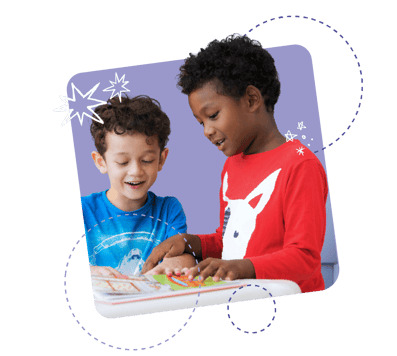 Two young students smiling while holding a large book open in front of their face, surrounded by a purple background and illustrated circle graphics Two young students smiling while holding a large book open in front of their face, surrounded by a purple background and illustrated circle graphics