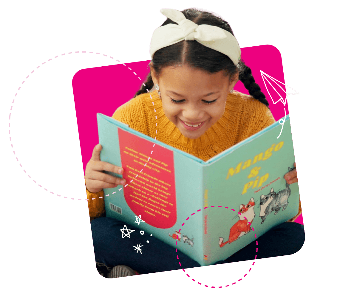 A young child laughing while holding a large book open in front of their face, surrounded by a pink background and illustrated circle graphics