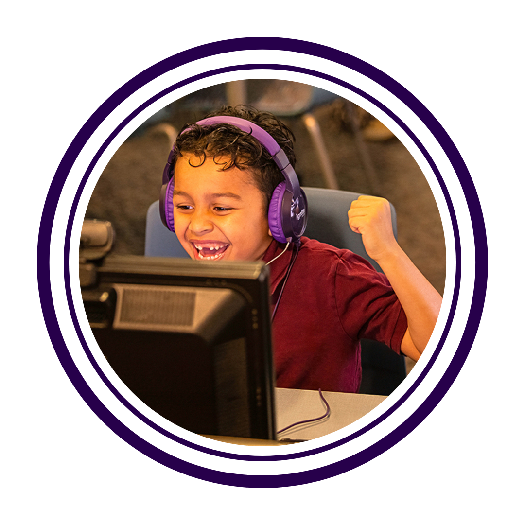 1st grader celebrating with his virtual tutor