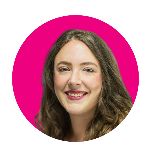 Woman's smiling face in front of a pink background Woman's smiling face in front of a pink background